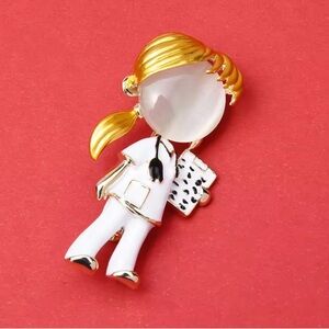 Gold and White Nurse Brooch.